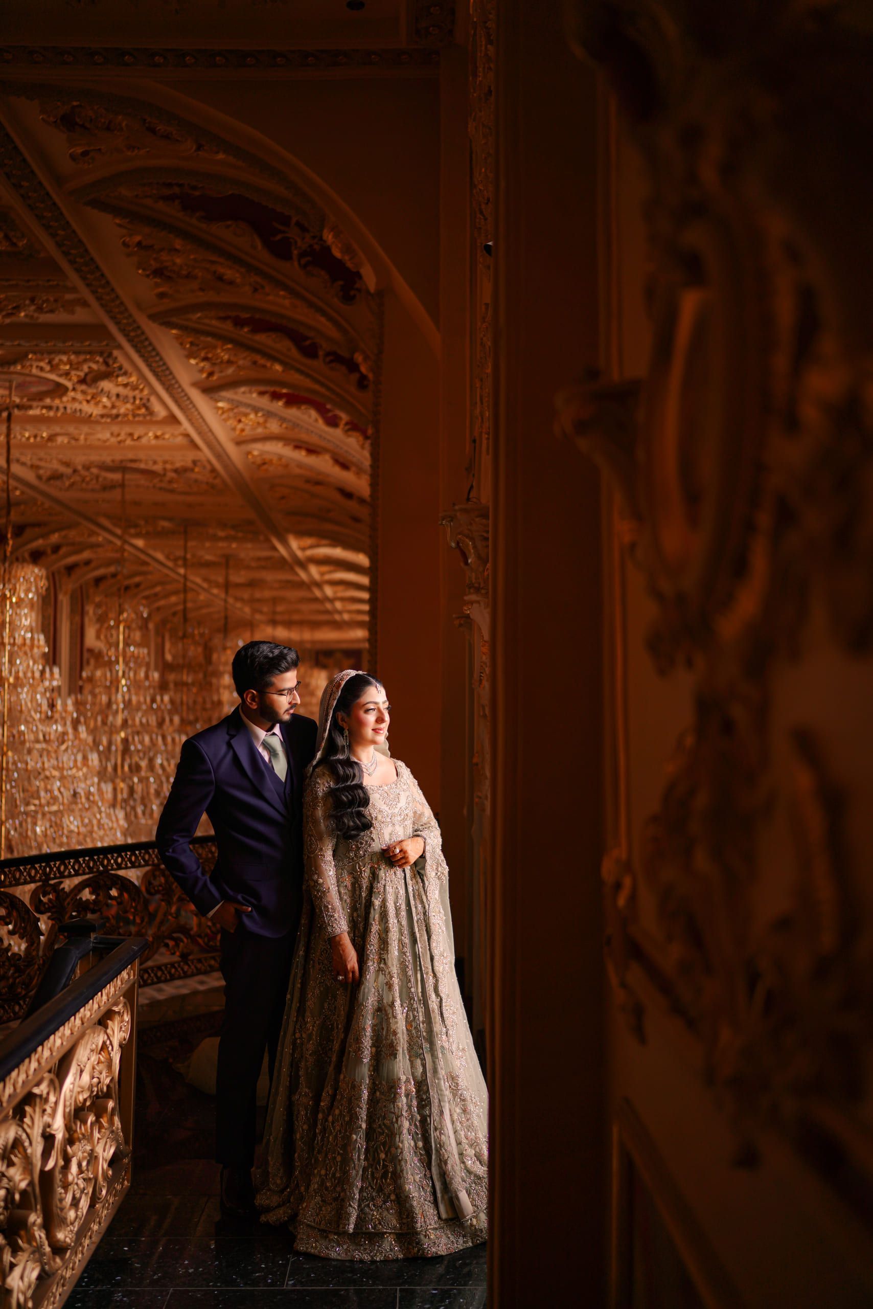 Bride and groom in an ornate gilded interior, Lahore wedding photography